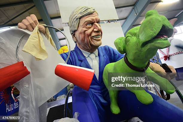 The Carnival parade float satirizing the primeminister of hesse Volker Bouffier and his deputy prime minister Tarek Al-Wazir in form of a green dog...