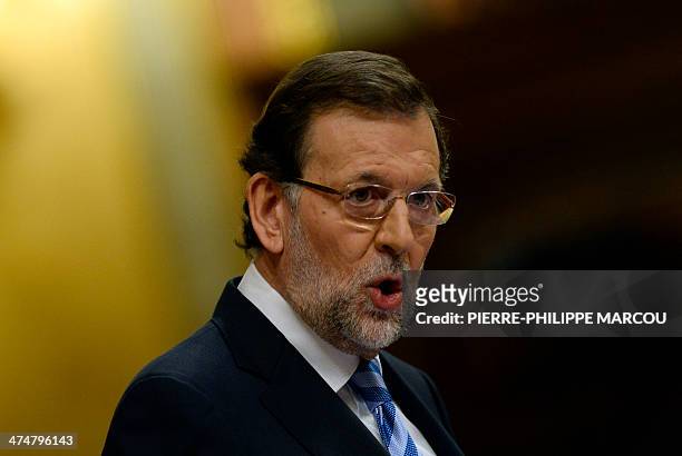Spanish Prime Minister Mariano Rajoy speaks during a debate on the state of the nation at the Congress of Deputies building in Madrid on February 25,...