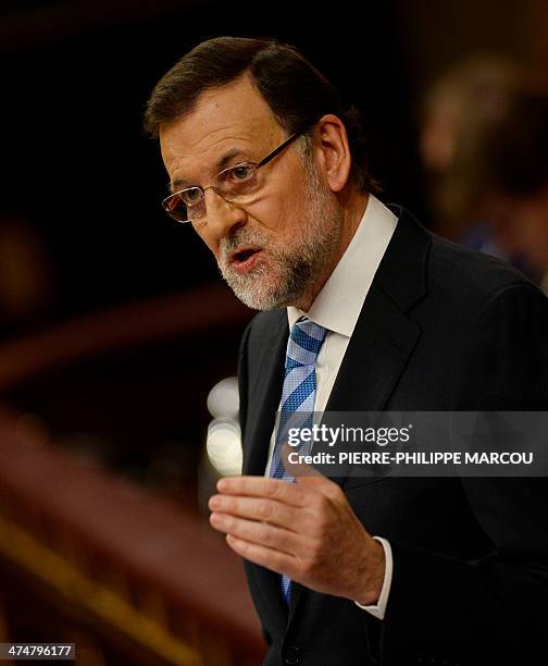 Spanish Prime Minister Mariano Rajoy speaks during a debate on the state of the nation at the Congress of Deputies building in Madrid on February 25,...