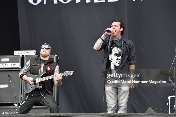 Frontman Darrin South and guitarist Andy James of English heavy metal group Sacred Mother Tongue performing live on the Main Stage at Download...