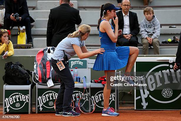 Christina Mchale of the United States receives treatment for an injury on court during her women's singles match against Lourdes Dominguez Lino of...