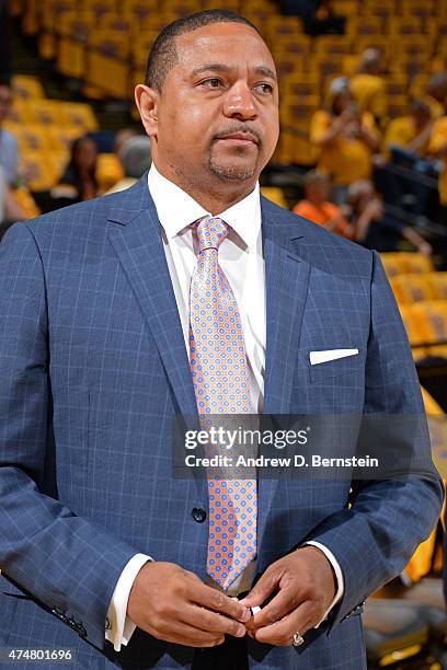 Mark Jackson stands on the court before a game between the Houston Rockets and Golden State Warriors in Game Two of the Western Conference Finals...