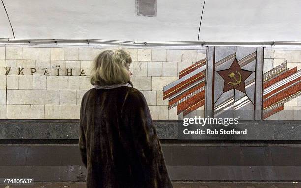 Woman waits on a platform at Palats "Ukrayina" metro station on February 25, 2014 in Kiev, Ukraine. Ukraine's interim President Olexander Turchynov...