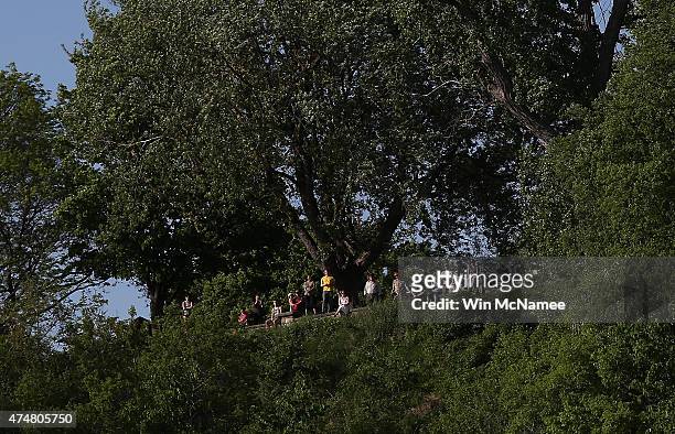 Spectators gather on a nearby hilltop to watch Democratic presidential candidate U.S. Sen. Bernie Sanders officially announcing his candidacy for the...