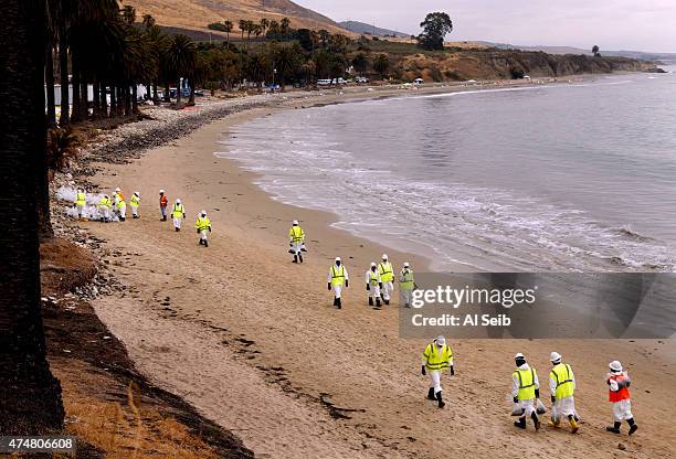 Crews in protective gear continue cleanup work at Refugio State Beach May 26, 2015 on the Gaviota Coast west of Goleta, California. Santa Barbara...