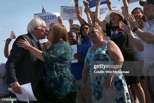 Sen. Bernie Sanders kisses his wife, Jane O'Meara Sanders, before officially announcing his candidacy for the U.S. Presidency during an event at...