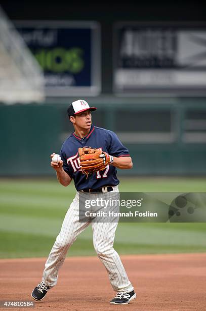 Doug Bernier of the Minnesota Twins warms up at shortstop during batting practice before the game against the Oakland Athletics on May 6, 2015 at...