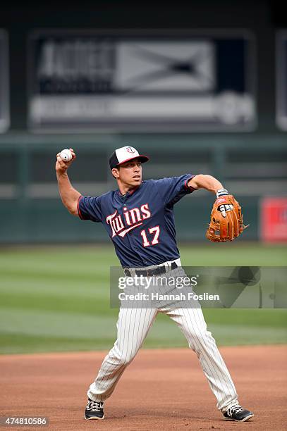 Doug Bernier of the Minnesota Twins warms up at shortstop during batting practice before the game against the Oakland Athletics on May 6, 2015 at...