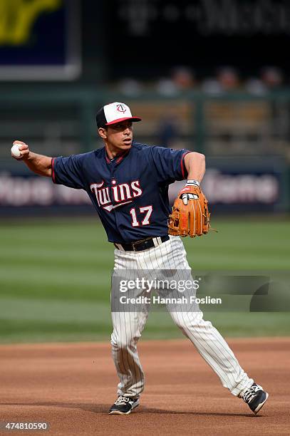 Doug Bernier of the Minnesota Twins warms up at shortstop during batting practice before the game against the Oakland Athletics on May 6, 2015 at...