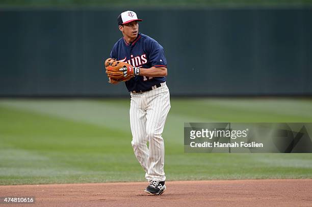 Doug Bernier of the Minnesota Twins warms up at shortstop during batting practice before the game against the Oakland Athletics on May 6, 2015 at...