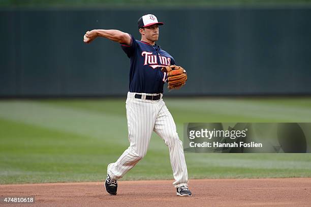 Doug Bernier of the Minnesota Twins warms up at shortstop during batting practice before the game against the Oakland Athletics on May 6, 2015 at...