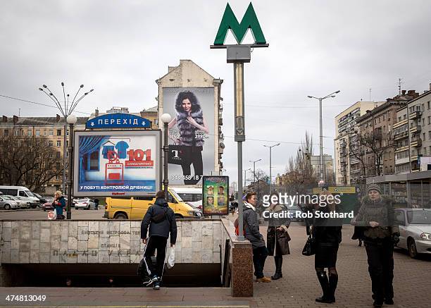People gather outside an entrance to Palats "Ukrayina" metro station on February 25, 2014 in Kiev, Ukraine. Ukraine's interim President Olexander...
