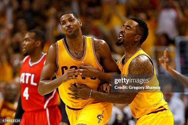 Tristan Thompson of the Cleveland Cavaliers celebrates with J.R. Smith after making a basket at the buzzer at the end of the first quarter against...