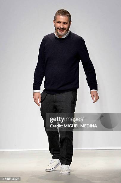 French designer Pascal Millet acknowledges the audience at the end of his 2014 Autumn/Winter ready-to-wear collection fashion show, on February 25,...