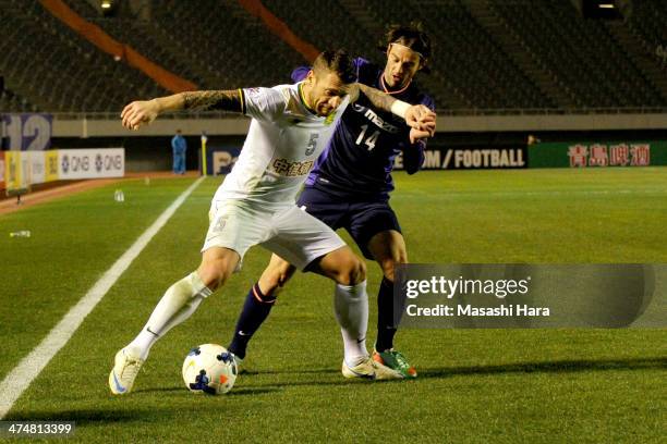 Darko Matic of Beijing Guoan and Mikic of Sanfrecce Hiroshima compete for the ball during the AFC Champions League match between Sanfrecce Hiroshima...