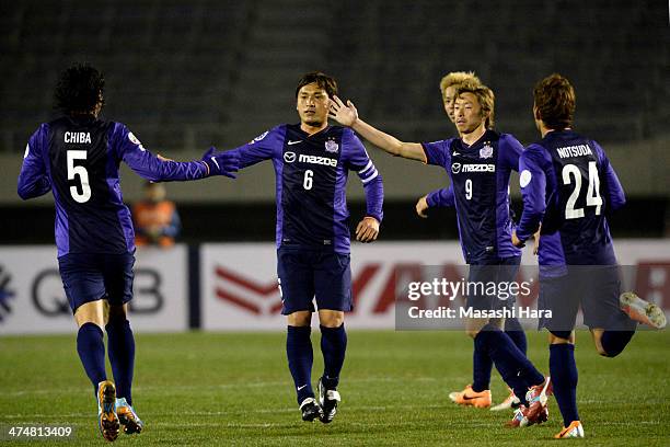 Toshihiro Aoyama , Naoki Ishihara celebrate the first goal by Kazuhiko Chiba of Sanfrecce Hiroshima during the AFC Champions League match between...