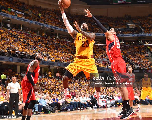 LeBron James of the Cleveland Cavaliers goes up for the layup against the Atlanta Hawks at the Quicken Loans Arena During Game Four of the Eastern...