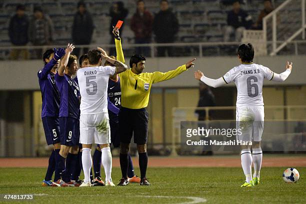 Darko Matic of Beijing Guoan is shown a red card during the AFC Champions League match between Sanfrecce Hiroshima and Beijing Guoan at Hiroshima Big...
