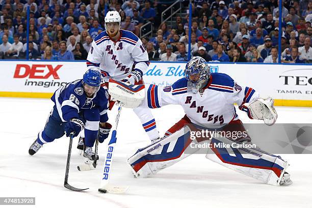 Henrik Lundqvist of the New York Rangers makes a stick save against Nikita Kucherov of the Tampa Bay Lightning during the second period in Game Six...