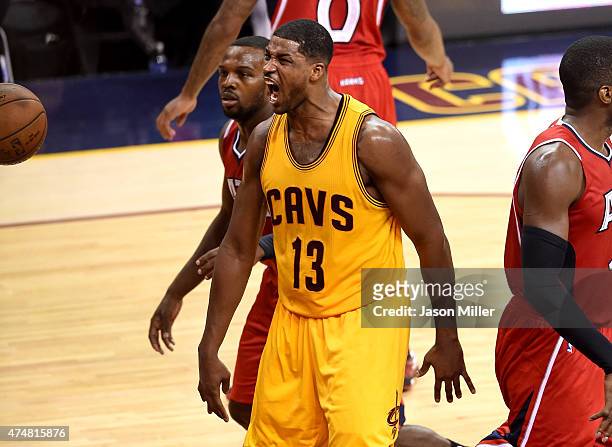 Tristan Thompson of the Cleveland Cavaliers reacts after a dunk in the third quarter against the Atlanta Hawks during Game Four of the Eastern...