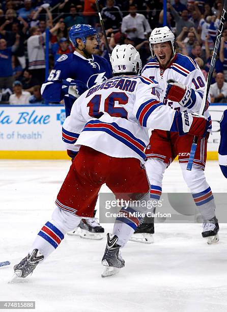 Miller of the New York Rangers celebrates with teammate Derick Brassard after scoring a goal against Ben Bishop of the Tampa Bay Lightning during the...