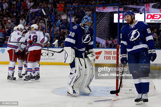 Miller of the New York Rangers celebrates with his teammates after scoring a goal against Ben Bishop of the Tampa Bay Lightning during the third...