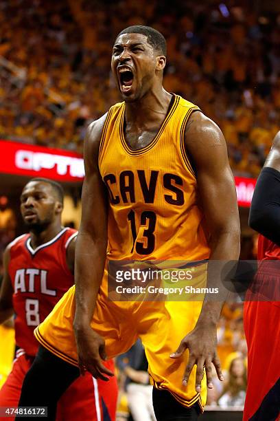 Tristan Thompson of the Cleveland Cavaliers reacts after a dunk in the third quarter against the Atlanta Hawks during Game Four of the Eastern...