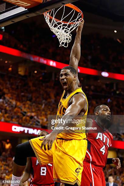 Tristan Thompson of the Cleveland Cavaliers reacts after a dunk in the third quarter against the Atlanta Hawks during Game Four of the Eastern...