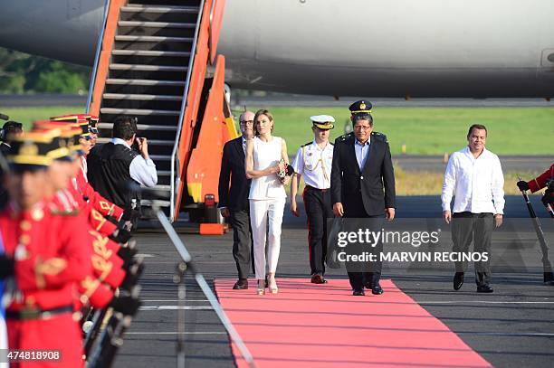 Spain's Queen Letizia walks with El Salvador's Vice-Minister of Foreign Affairs Jaime Miranda upon arrival for an official visit at the Oscar Arnulfo...