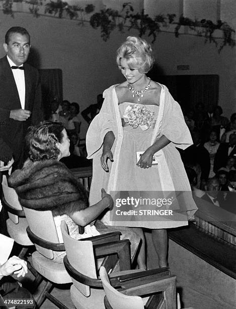 Picture released on September 1958 of French actress Brigitte Bardot attending the premiere of the film "En cas de malheur" directed by Claude...