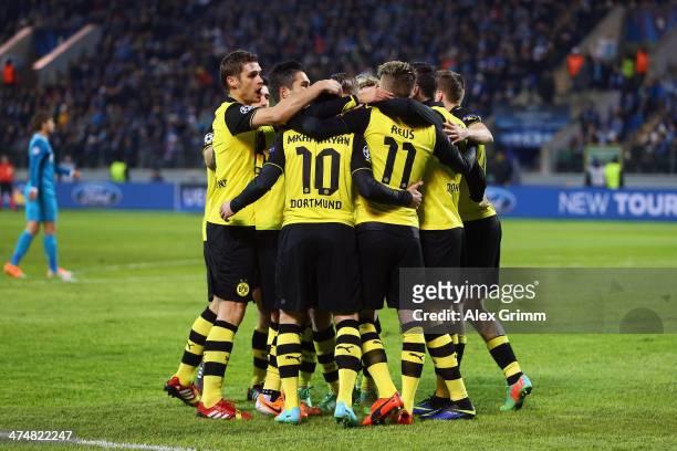 Marco Reus of Dortmund celebrates his team's second goal with team mates during the UEFA Champions League Round of 16 match between FC Zenit and...