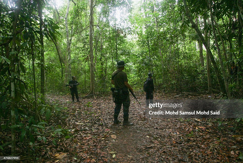 Malaysian Officials Retrieve Bodies From Mass Grave Sites