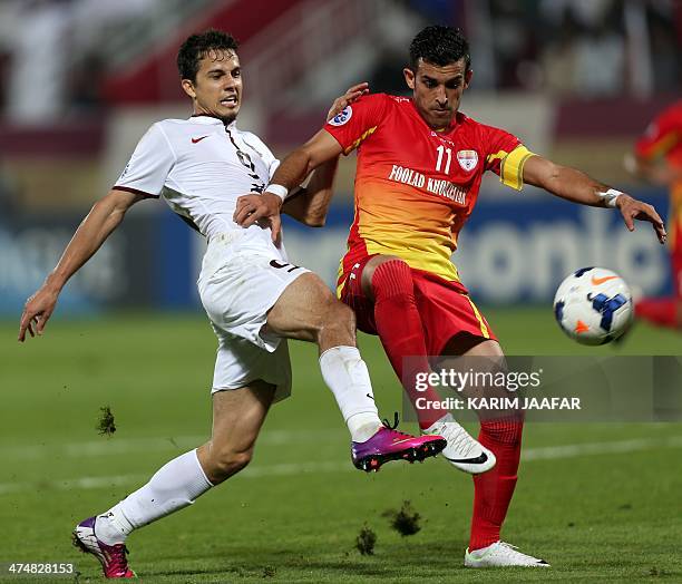 Qatar's Al-Jaish Brazilian player Nilmar Da Silva fights for the ball with Bakhtiar Rahmani of Iran's Foolad Khouzestan during their AFC Champions...