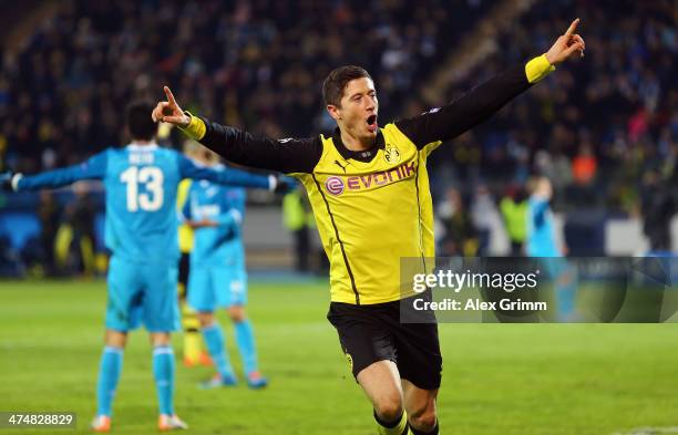 Robert Lewandowski of Dortmund celebrates his team's fourth goal during the UEFA Champions League Round of 16 match between FC Zenit and Borussia...