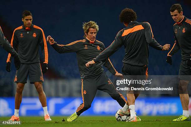 Fabio Coentrao of Real Madrid practices with team mates ahead of the Champions League match between FC Schalke 04 and Real Madrid at Veltins-Arena on...