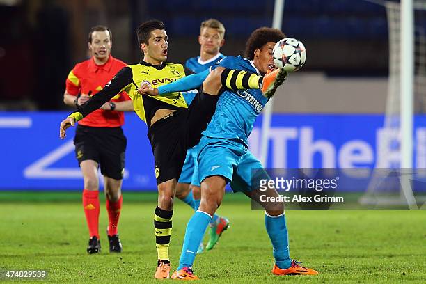 So28 of Zenit is challenged by Nuri Sahin of Dortmund during the UEFA Champions League Round of 16 match between FC Zenit and Borussia Dortmund at...