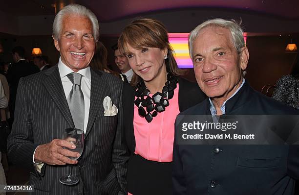 George Hamilton, Mila Mulroney and Simon Reuben attend an after party celebrating the VIP Gala Preview of "The Elephant Man" at The Haymarket Hotel...