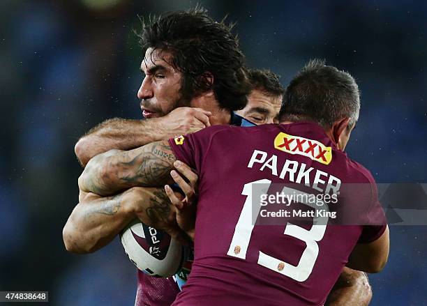 James Tamou of the Blues is tackled during game one of the State of Origin series between the New South Wales Blues and the Queensland Maroons at ANZ...