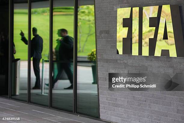Logo sits next to the entrance to the FIFA headquarters on May 27, 2015 in Zurich, Switzerland. Swiss police on Wednesday raided a Zurich hotel to...