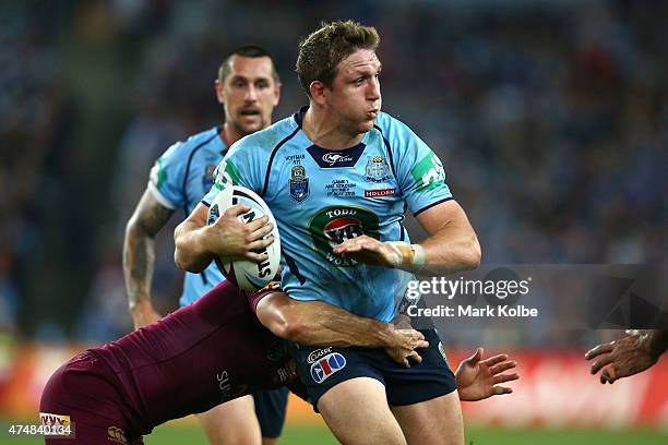 Ryan Hoffman of the Blues is tackled during game one of the State of Origin series between the New South Wales Blues and the Queensland Maroons at...