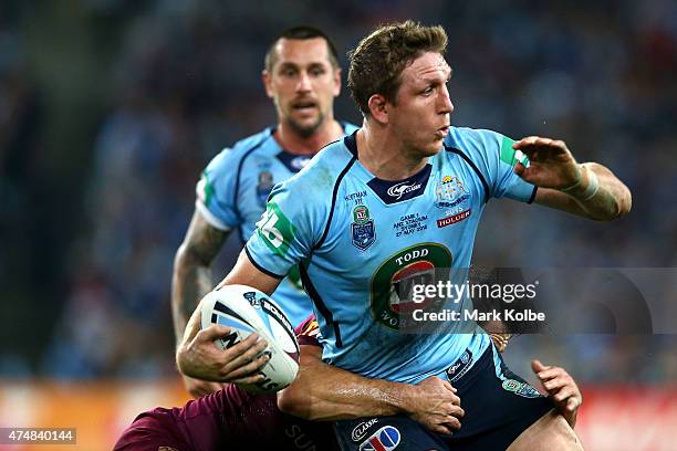 Ryan Hoffman of the Blues is tackled during game one of the State of Origin series between the New South Wales Blues and the Queensland Maroons at...