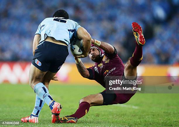 Will Hopoate of the Blues is tackled by Johnathan Thurston of the Maroons during game one of the State of Origin series between the New South Wales...