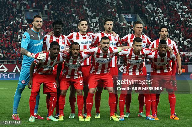 Olympiakos's players Spanish goalie Roberto, Congolese midfielder Denvil N'Dinga, Greek defender Kostas Manolas, Spanish defender Ivan Marcano, Greek...