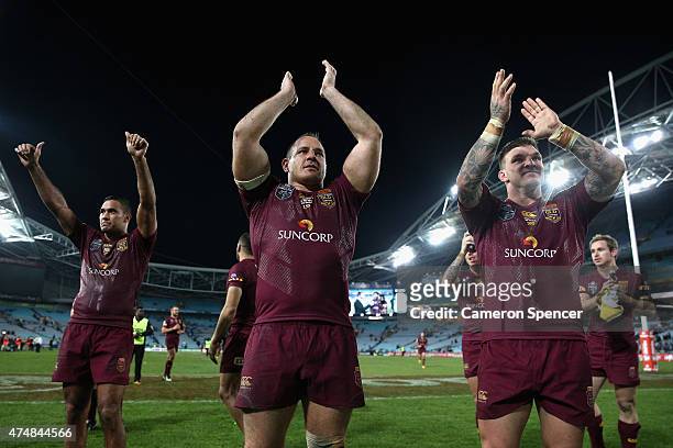 Justin Hodges, Matt Scott and Josh McGuire of the Maroons thank fans after winning game one of the State of Origin series between the New South Wales...