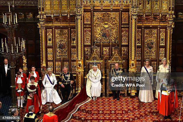 Queen Elizabeth II prepares to give the Queen's Speech from the throne in the House of Lords next to Prince Philip, Duke of Edinburgh and Prince...