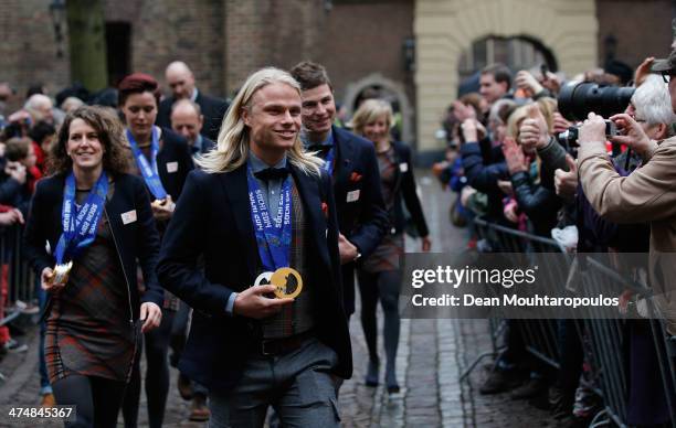 Koen Verweij, Sven Kramer and Ireen Wust walk towards the Prime Ministers house prior to the Dutch Winter Olympic Medal winners ceremony held at the...