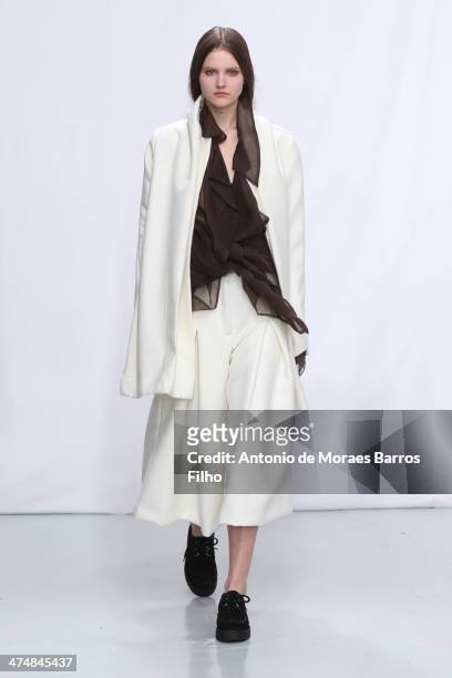Model walks the runway during the Moon Young Hee show as part of the Paris Fashion Week Womenswear Fall/Winter 2014-2015 on February 25, 2014 in...