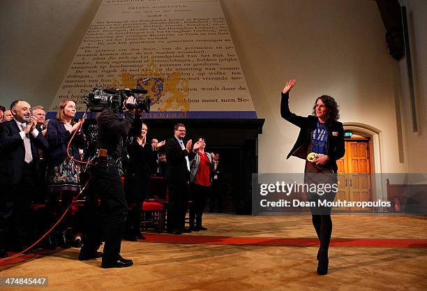 Ireen Wust arrives in the main hall for the Dutch Winter Olympic Medal winners ceremony held at the Ridderzaal on February 25, 2014 in The Hague,...