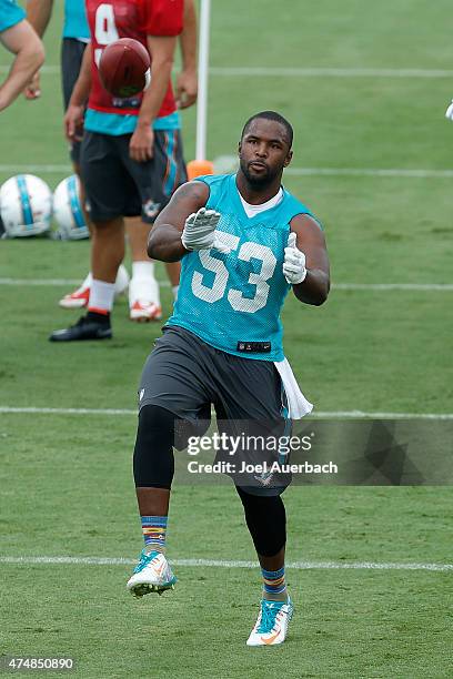 Jelani Jenkins of the Miami Dolphins catches the ball during the teams first OTA's on May 26, 2015 at the Miami Dolphins training facility in Davie,...
