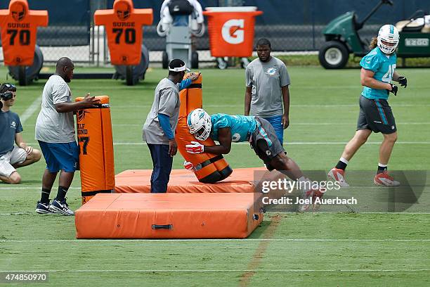 Neville Hewitt of the Miami Dolphins runs a drill during the teams first OTA's on May 26, 2015 at the Miami Dolphins training facility in Davie,...